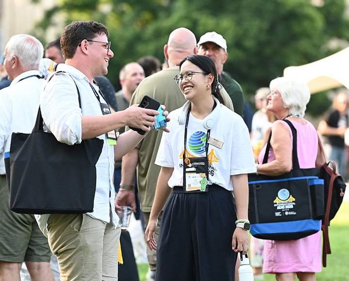 Ivy Chou greets an attendee