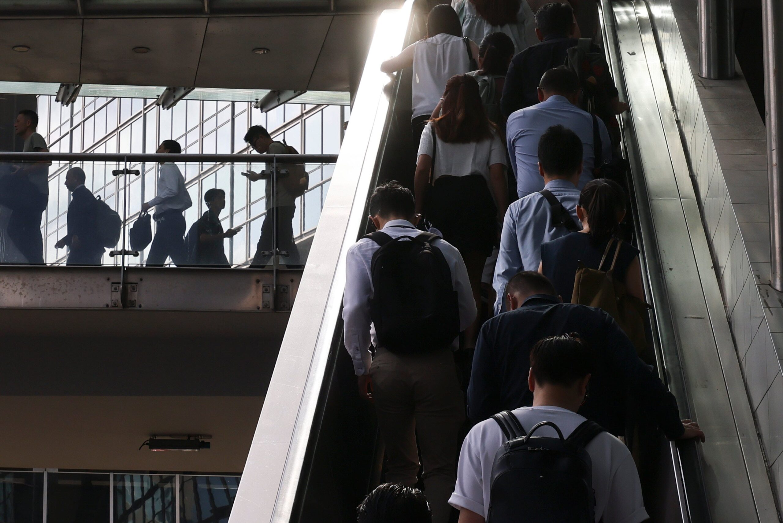 Workers in Central during the morning rush hour. A third-quarter outlook survey by ManpowerGroup shows the city’s net employment outlook stood at minus 9 per cent. Photo: Nora Tam