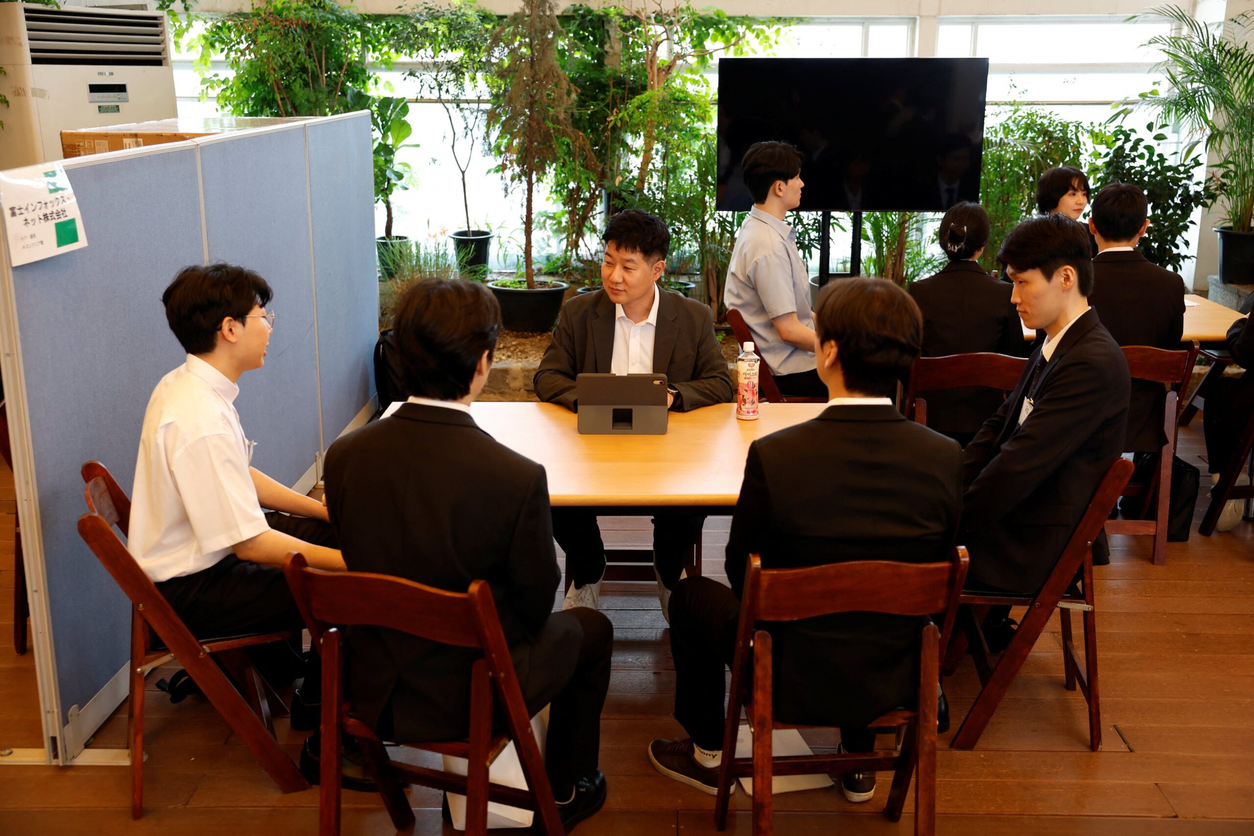 South Korean jobseekers take part in a group interview with representatives of a Japanese company during a job fair in Seoul on July 12. Photo: Reuters