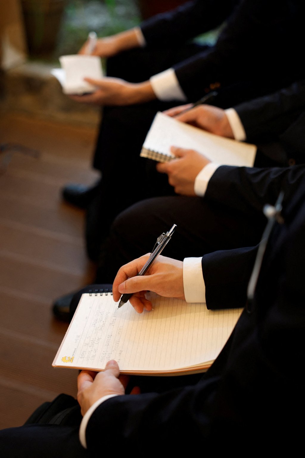 South Korean jobseekers take notes during a presentation at a fair connecting applicants with Japanese employers in Seoul on July 12. Photo: Reuters