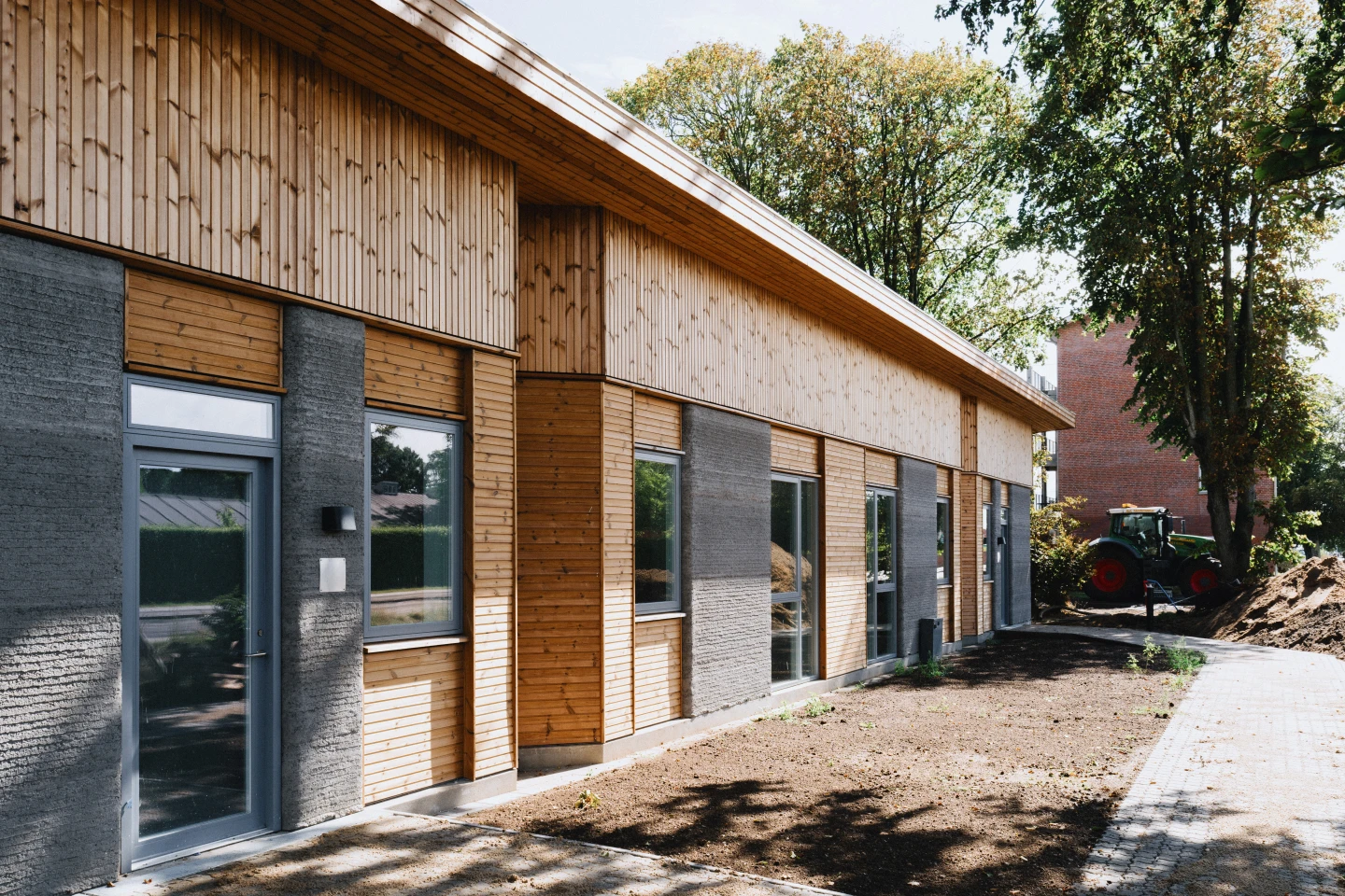 Skovsporet's 36 apartments are arranged across six buildings that share landscaped outdoor spaces