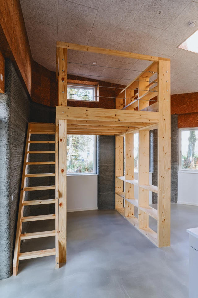 Some of the Skovsporet apartments' sleeping areas are raised, like a loft bed, enabling space for study underneath