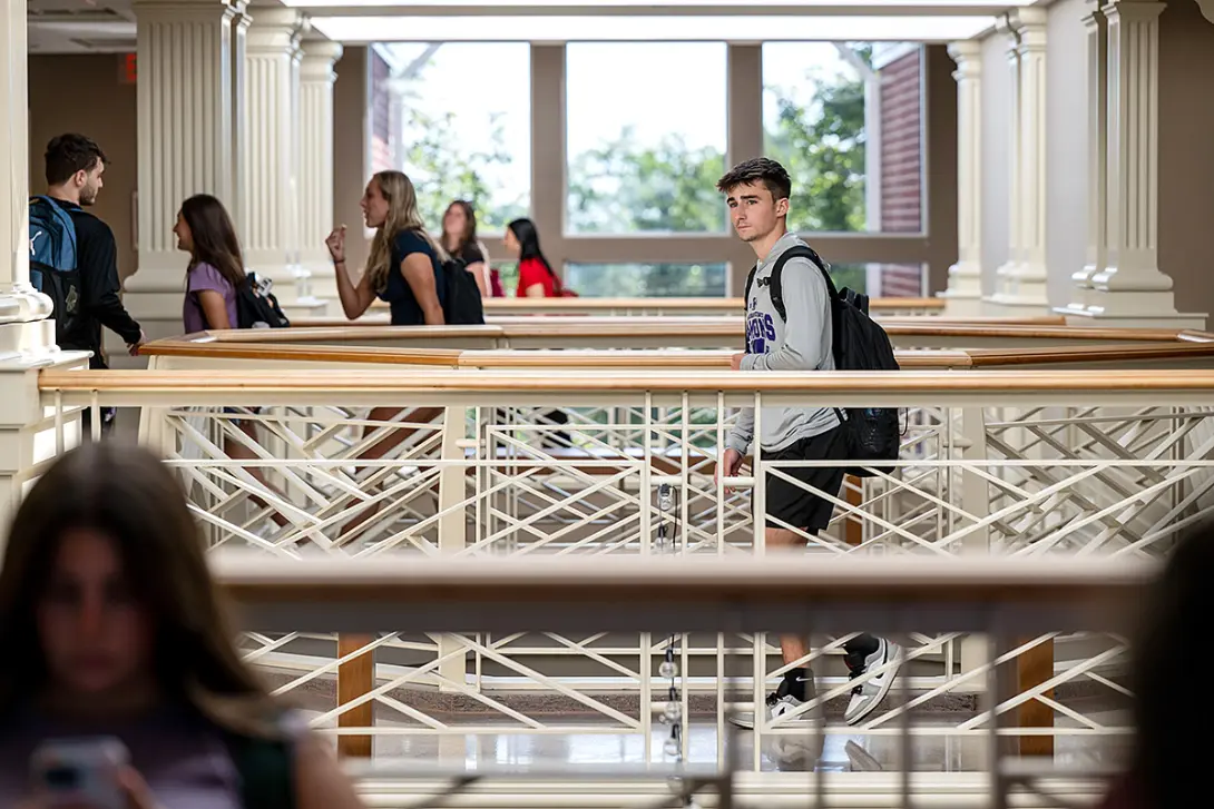 students walking to class on upper level of COBE in fall 2025