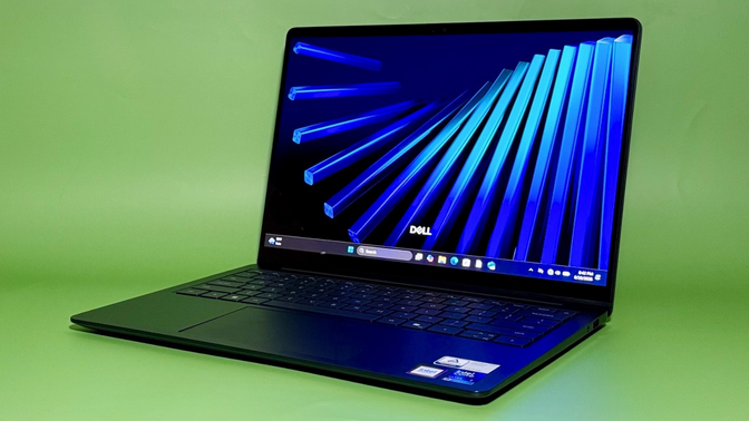 the dell 14s against a green background