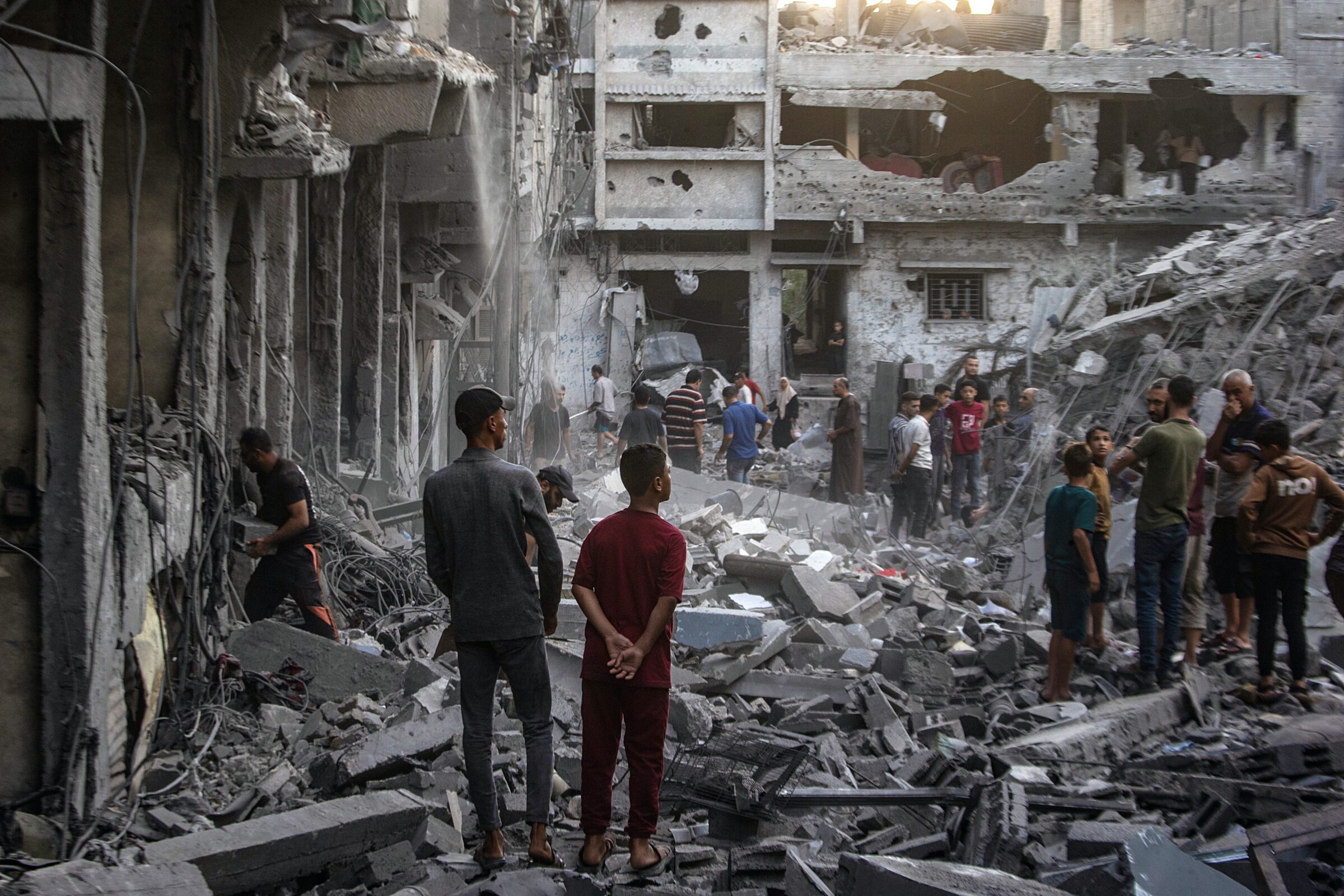Palestinians inspect the rubble of destroyed homes following an Israeli airstrike in the Al-Sabra neighborhood of Gaza City on 9 October 2026, which killed at least three people, including an eight-year-old boy